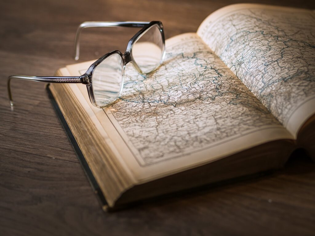atlas, book, glasses