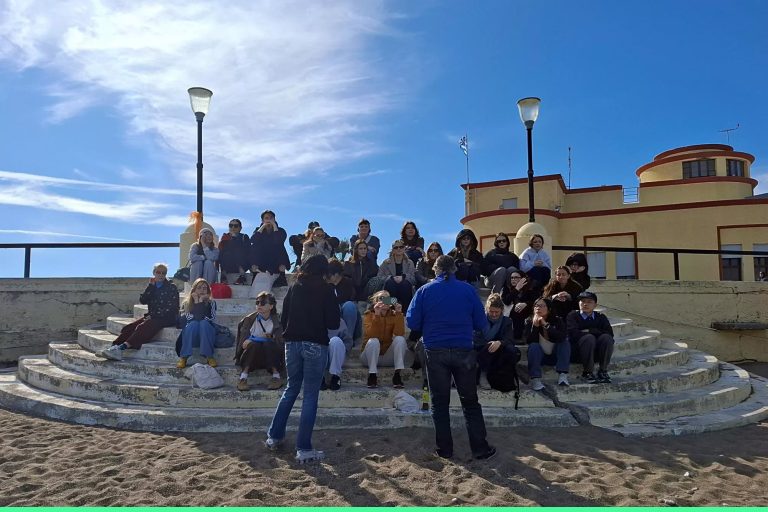 Students from USWPS and UAEGEAN sit on historic steps in Rhodos Greece